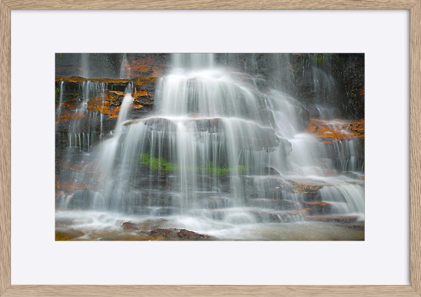 65997376 Waterfall coming down on the cliffs copy - ArtFramed