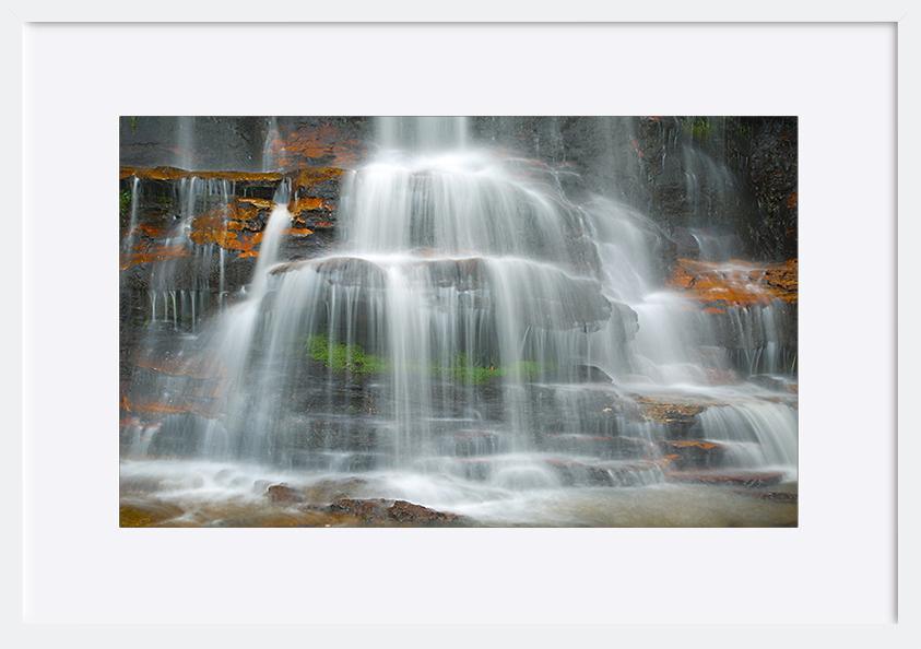 65997376 Waterfall coming down on the cliffs copy - ArtFramed